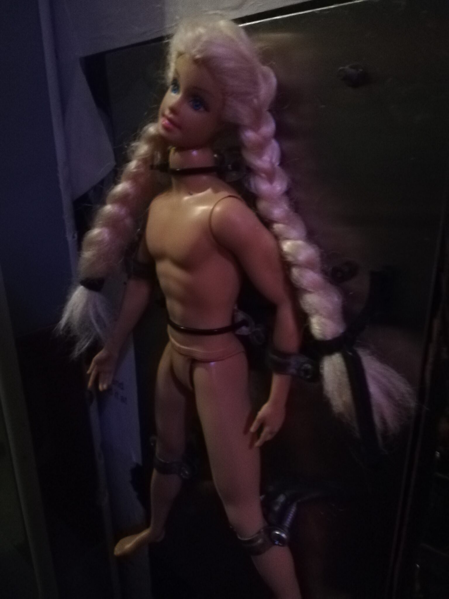 Barbie head in a Ken body, picture taken form queer bar in Barcelona, Madamme Yasmine.